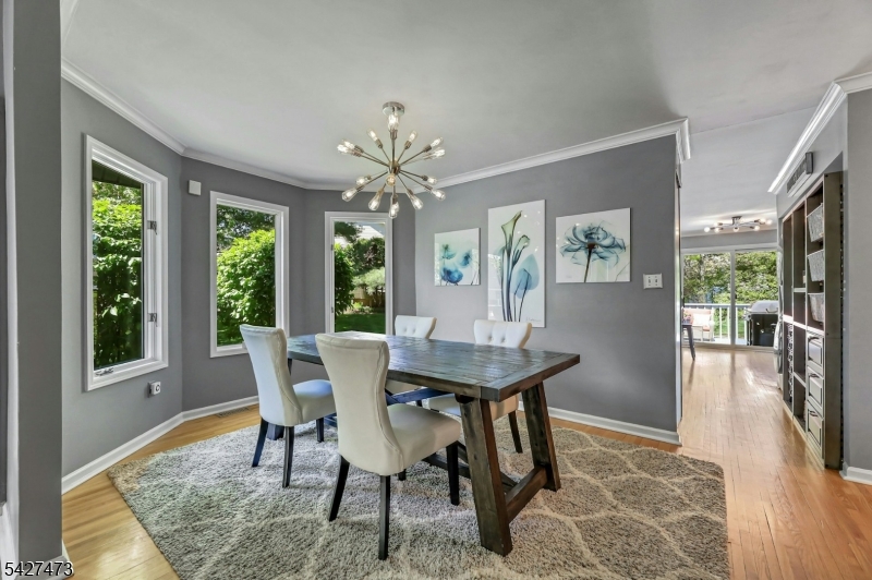 100 Easedale Road, Unit 100 Wayne, NJ 07470 - Photo 12 of 43 a view of a dining room with furniture window and wooden floor