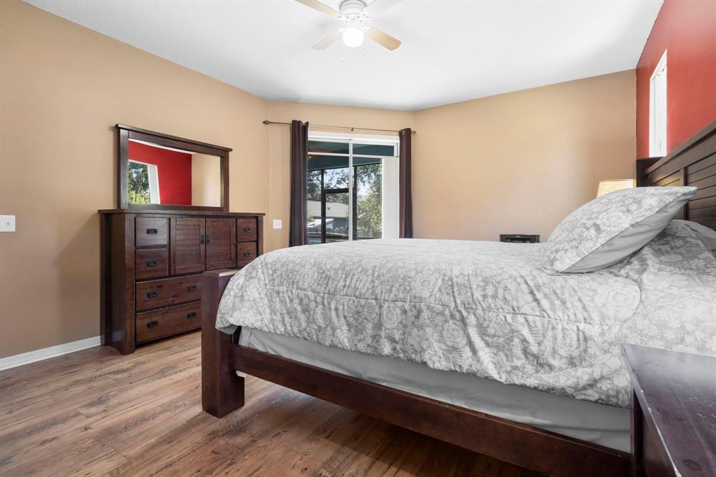 6480 Fall Street St. Cloud, FL 34771 - Photo 21 of 47 a bedroom with a bed and dresser