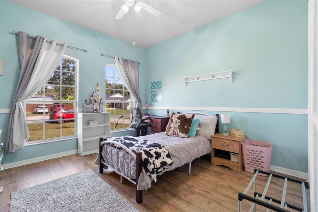 6480 Fall Street St. Cloud, FL 34771 - Photo 25 of 47 a bedroom with a bed and a window