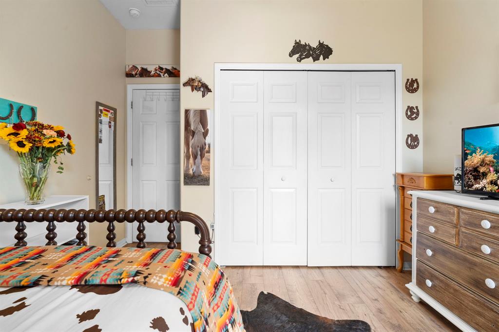 6480 Fall Street St. Cloud, FL 34771 - Photo 31 of 47 a bedroom with a bed and a dresser