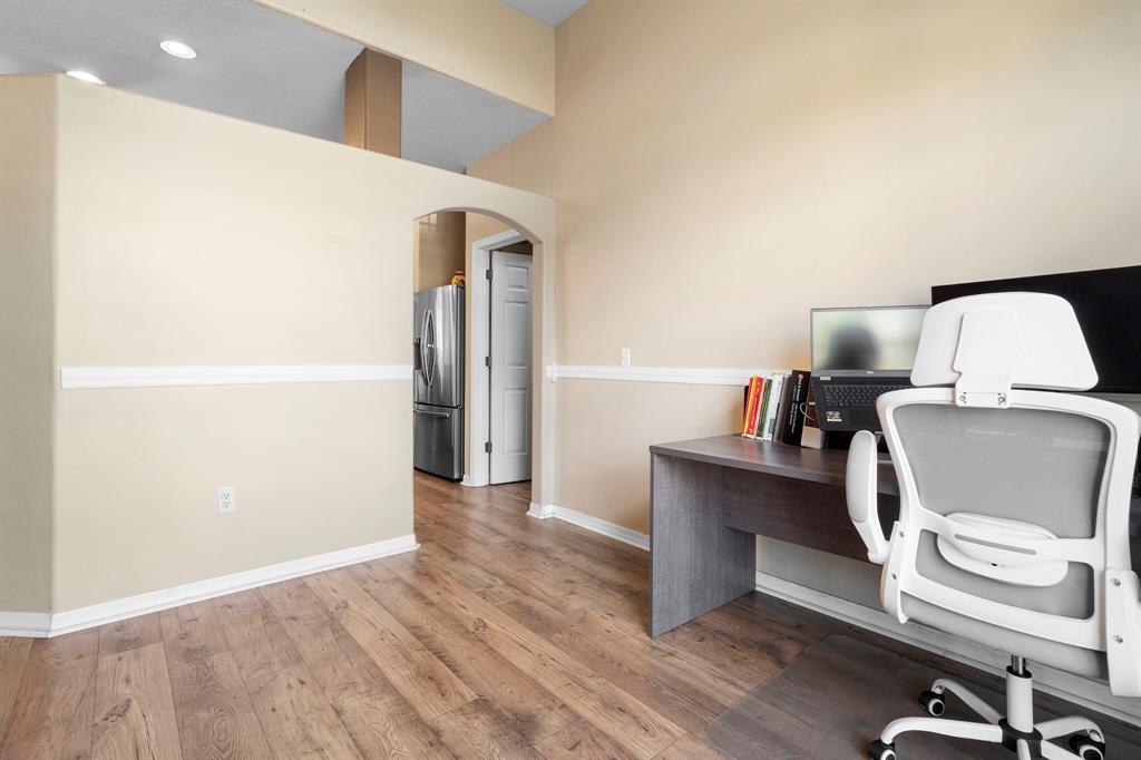 6480 Fall Street St. Cloud, FL 34771 - Photo 37 of 47 a view of a workspace with furniture and wooden floor