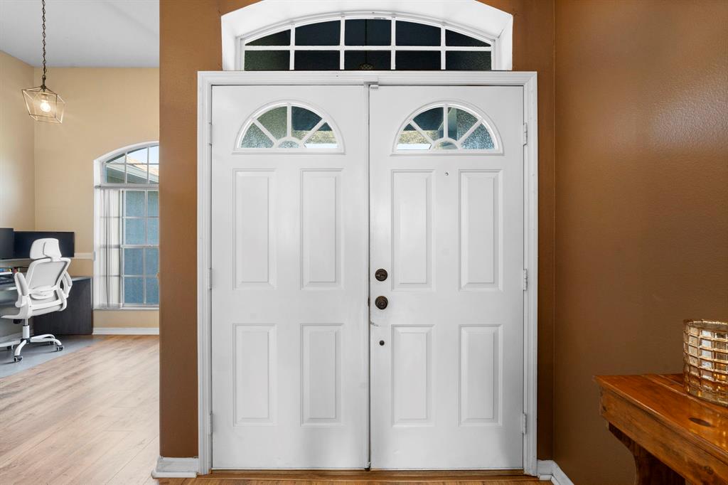 6480 Fall Street St. Cloud, FL 34771 - Photo 4 of 47 a front view of a house with wooden floor