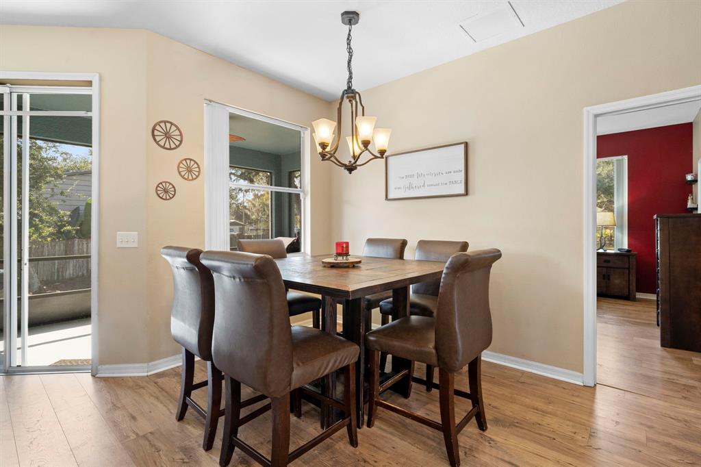 6480 Fall Street St. Cloud, FL 34771 - Photo 9 of 47 a view of a dining room with furniture wooden floor and chandelier