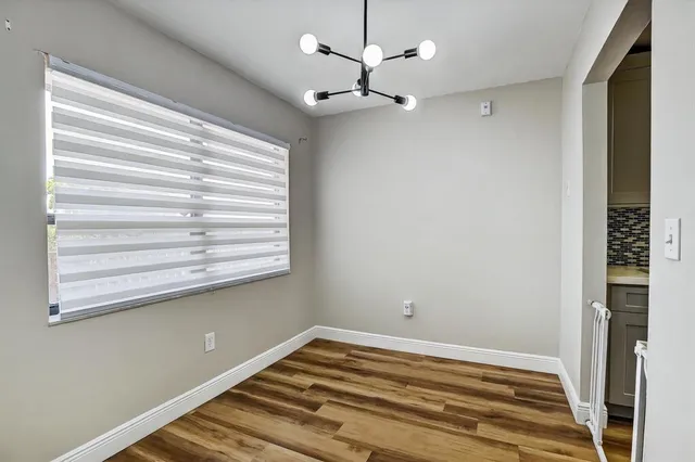a view of a hallway with washer and dryer