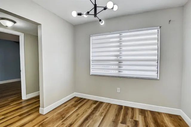 a view of an empty room and window