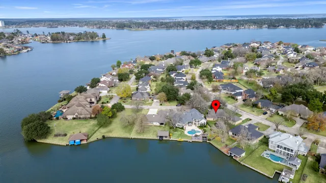 an aerial view of a house with a lake view
