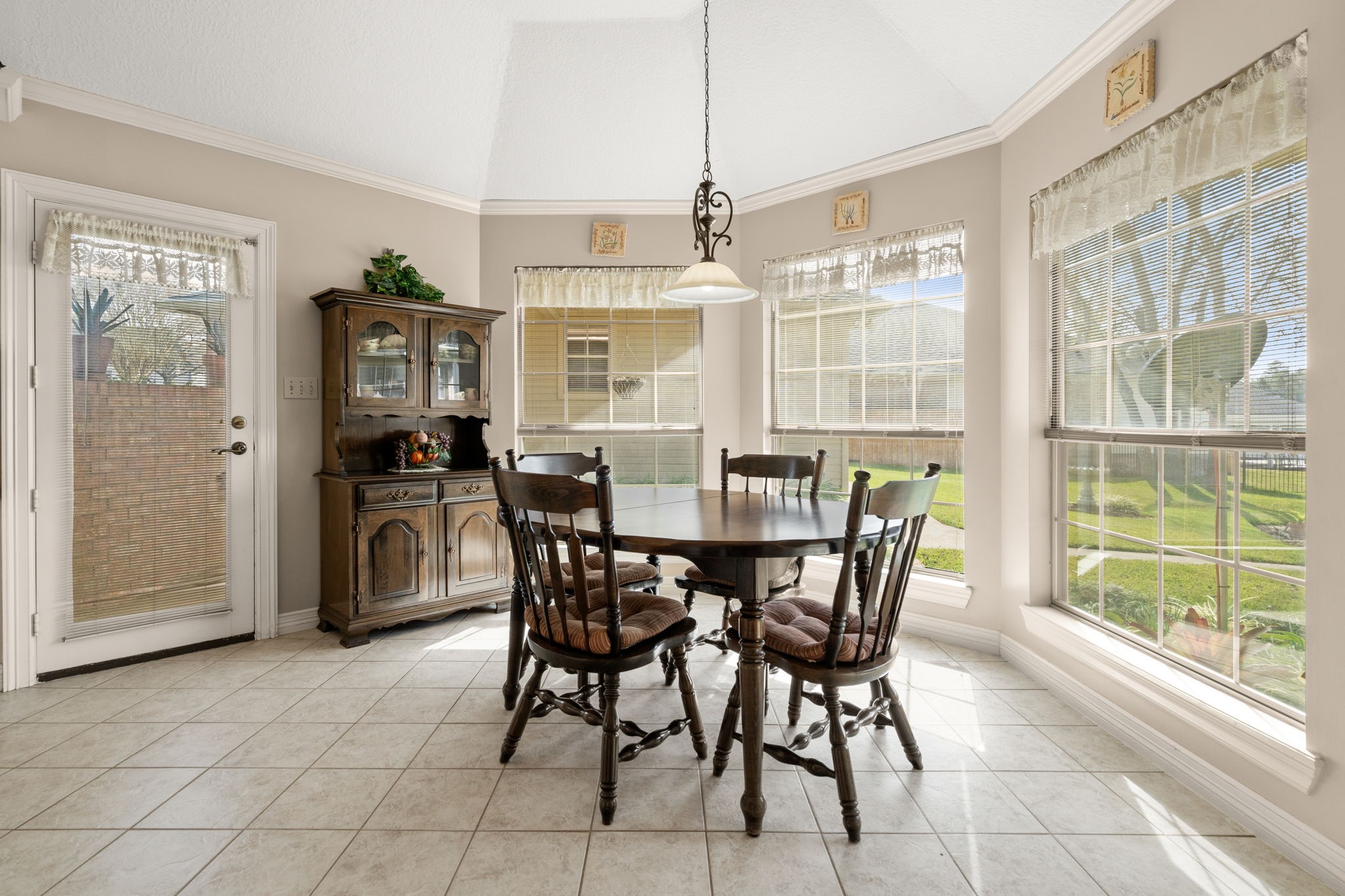 100 April Breeze Conroe, TX 77356 - Photo 13 of 40 Tiled breakfast room with water views.