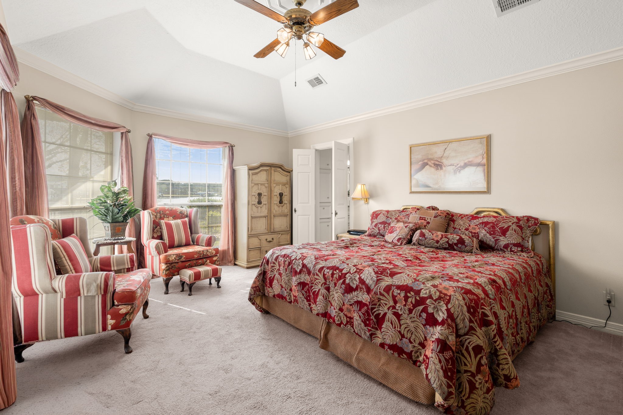 100 April Breeze Conroe, TX 77356 - Photo 18 of 40 Primary bedroom with high ceilings and water view.