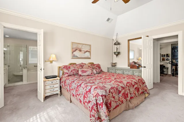 a bedroom with a bed and a cabinets