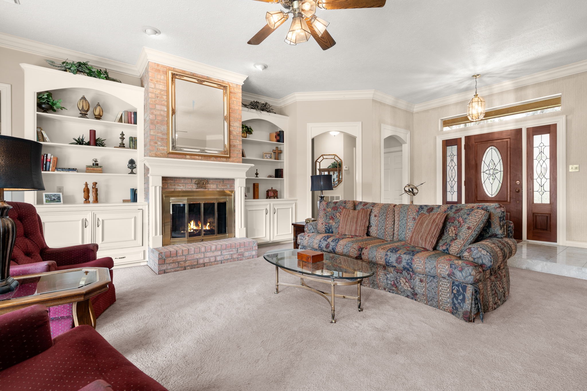 100 April Breeze Conroe, TX 77356 - Photo 10 of 40 Bookshelves and storage flank either side of the fireplace.
