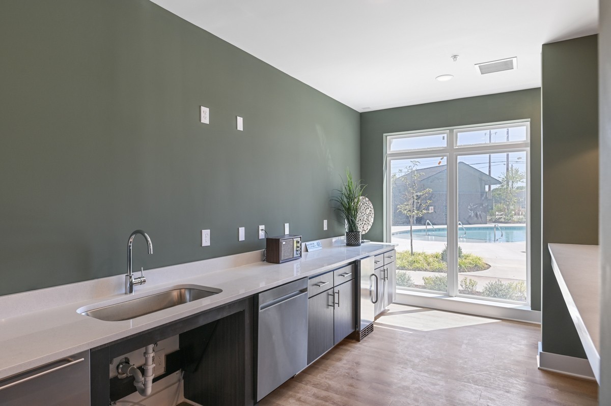 1540 Lebanon Pike, Unit 415 Nashville, TN 37210 - Photo 34 of 52 a bathroom with a double vanity sink and a large mirror