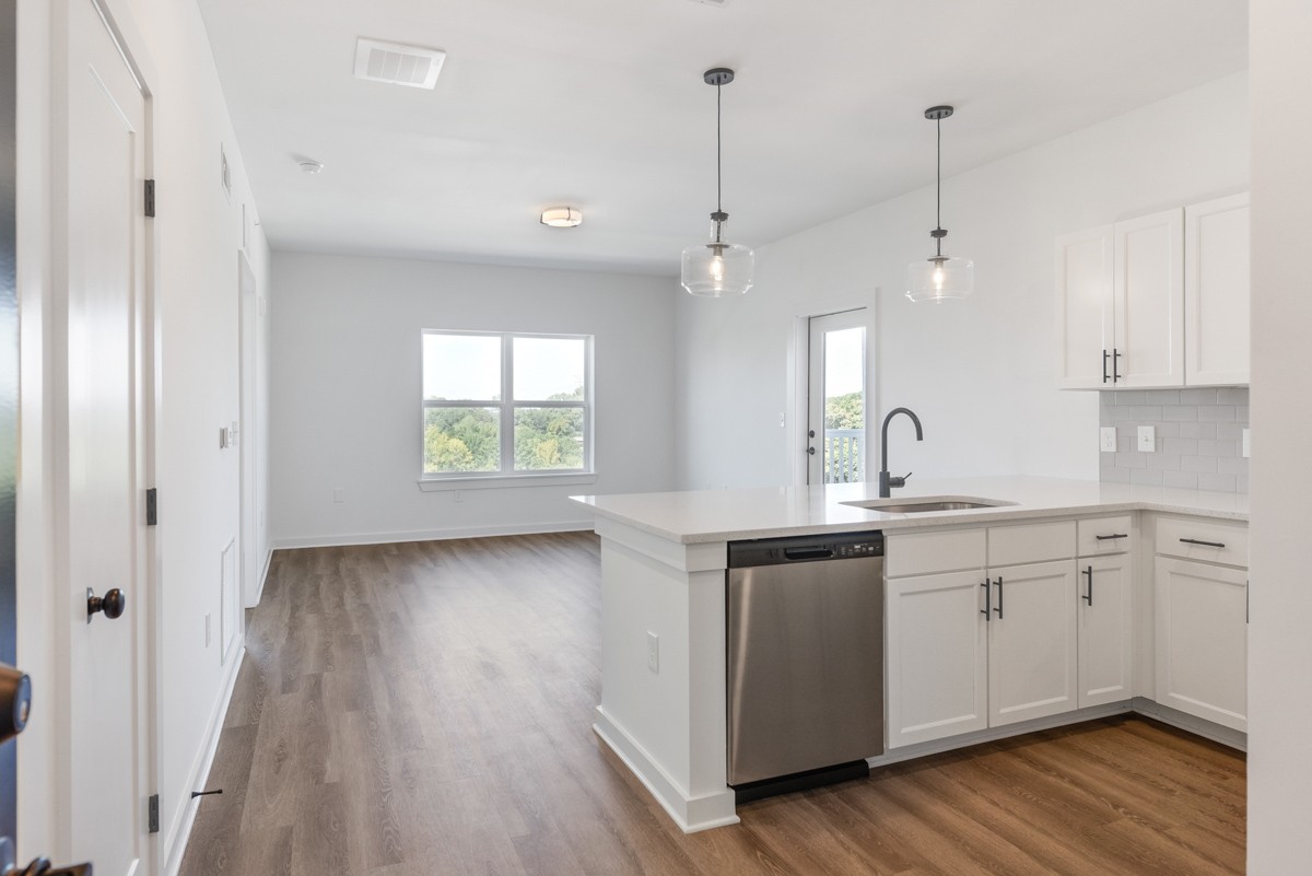 1540 Lebanon Pike, Unit 415 Nashville, TN 37210 - Photo 6 of 52 a kitchen with a sink window and wooden floor