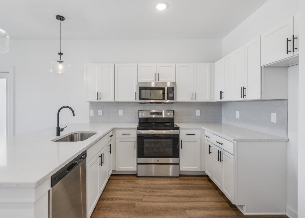 1540 Lebanon Pike, Unit 415 Nashville, TN 37210 - Photo 8 of 52 a kitchen with stainless steel appliances granite countertop a sink stove and white cabinets