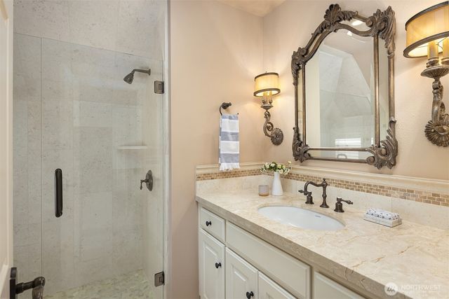 a bathroom with double sink and a mirror