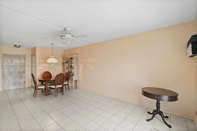 a view of a dining room with furniture wooden floor and chandelier