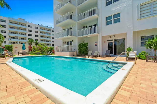 a view of swimming pool with outdoor seating