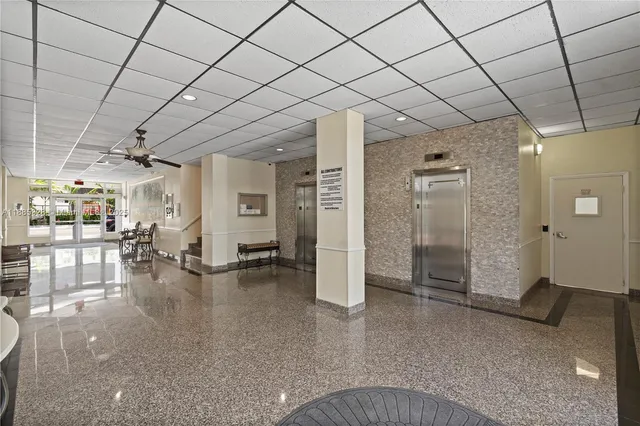 a living room with couches a dining table and chairs with outer view