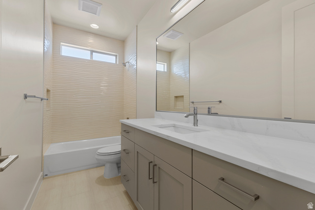 2955 East Rimrunner Drive St. George, UT 84790 - Photo 26 of 35 Bathroom featuring a full-length vanity mirror, a single basin sink, and a spacious vanity with integrated storage