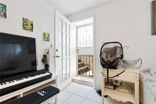 a view of a dining room with furniture and a chandelier