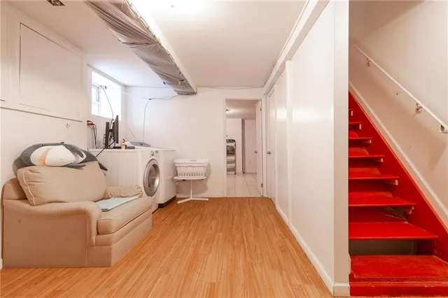 a view of a storage & utility room with wooden floor