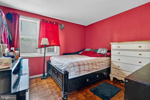 a bed room with a bed and a window