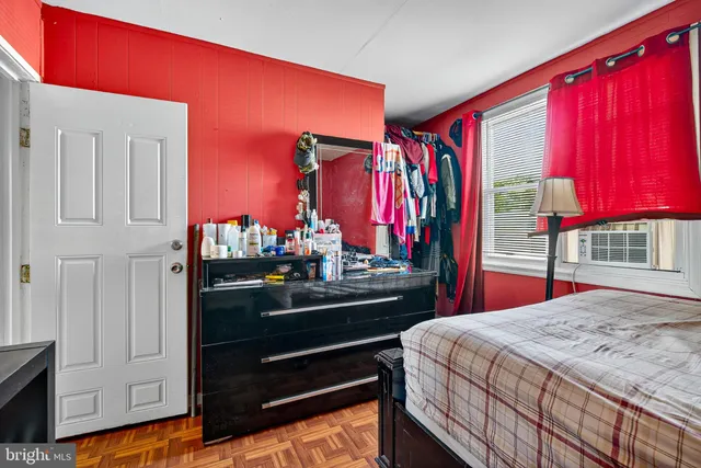 a bed room with a bed and a window