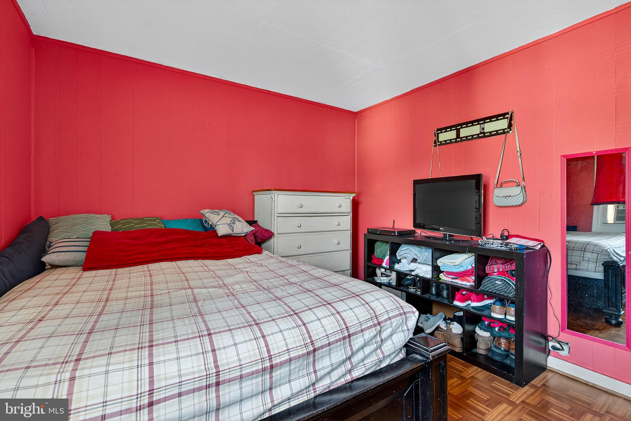 1109 Quantril Way Baltimore, MD 21205 - Photo 14 of 18 a bedroom with a bed and a flat screen tv