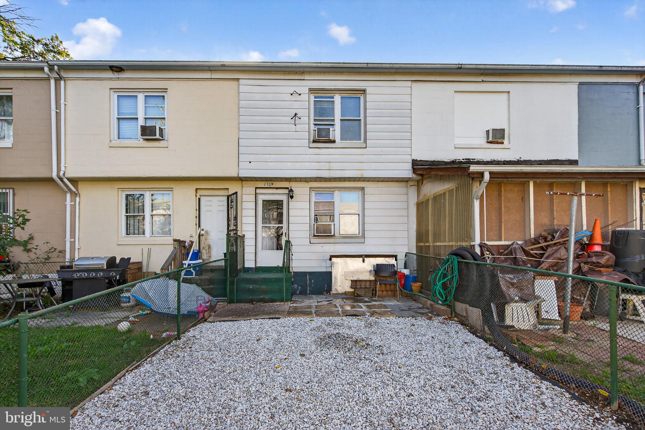 1109 Quantril Way Baltimore, MD 21205 - Photo 15 of 18 a front view of a house with patio