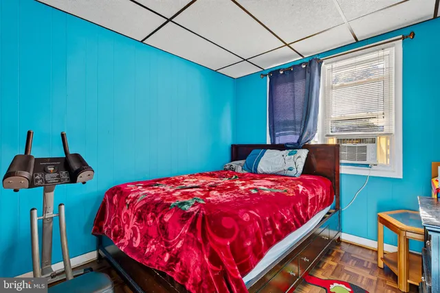 a bedroom with a bed and a closet