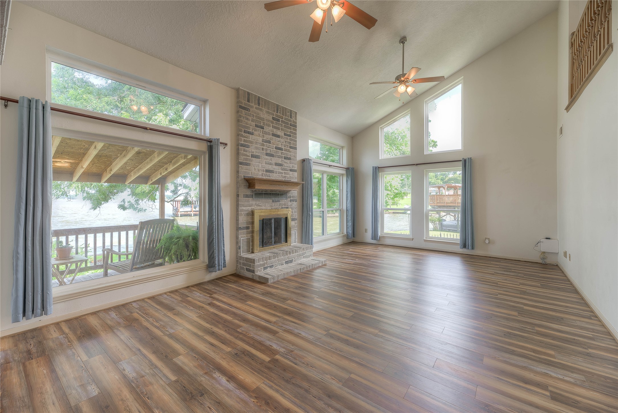 440 Lakeview Dr Loop Coldspring, TX 77331 - Photo 12 of 44 SPACIOUS LIVING GAREA,BRICK FIREPLACE, LAKE VIEW FROM ALL WINDOWS