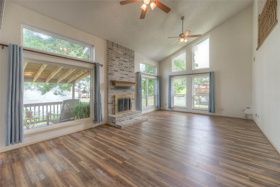 440 Lakeview Dr Loop Coldspring, TX 77331 - Photo 12 of 44 a view of an empty room with wooden floor and a window