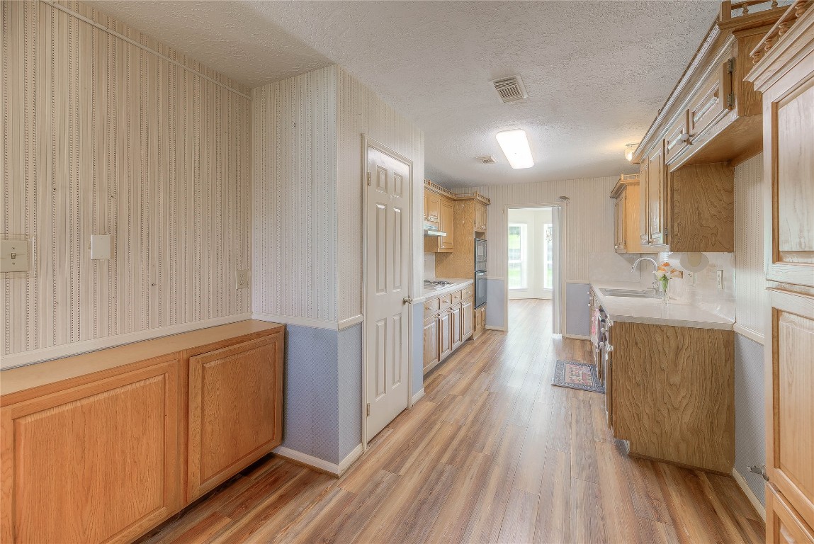 440 Lakeview Dr Loop Coldspring, TX 77331 - Photo 20 of 44 a view of a kitchen with wooden floor and staircase