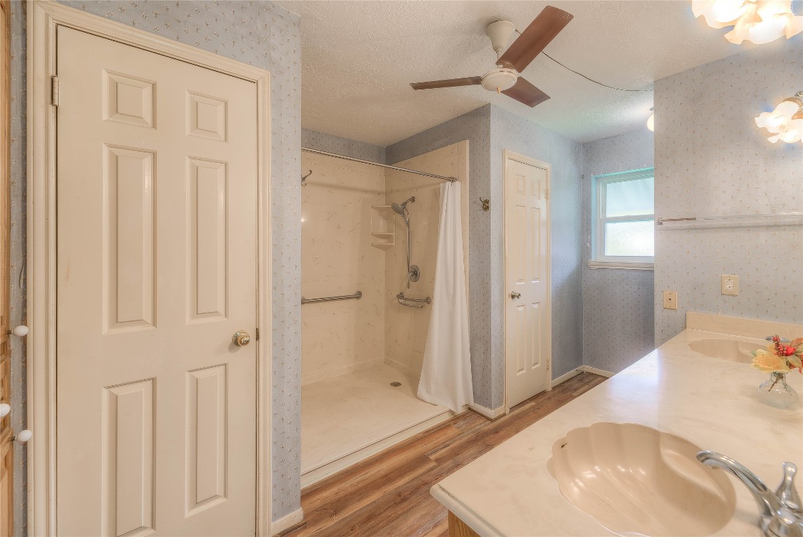 440 Lakeview Dr Loop Coldspring, TX 77331 - Photo 26 of 44 a bathroom with a tub and shower