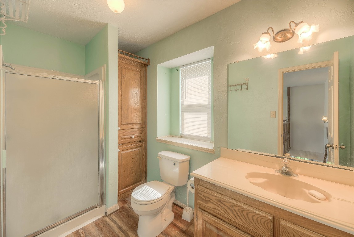 440 Lakeview Dr Loop Coldspring, TX 77331 - Photo 29 of 44 a bathroom with a sink a toilet and shower