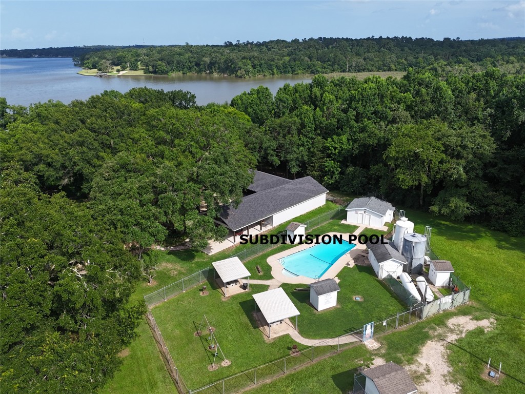 440 Lakeview Dr Loop Coldspring, TX 77331 - Photo 40 of 44 an aerial view of residential houses with outdoor space and river