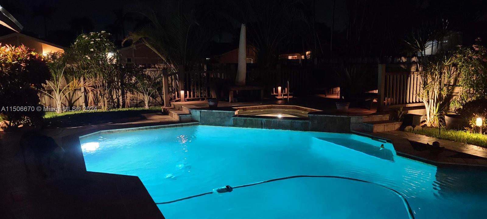13341 Southwest 101st Street Miami, FL 33186 - Photo 1 of 43 a view of a swimming pool with an outdoor space and seating area