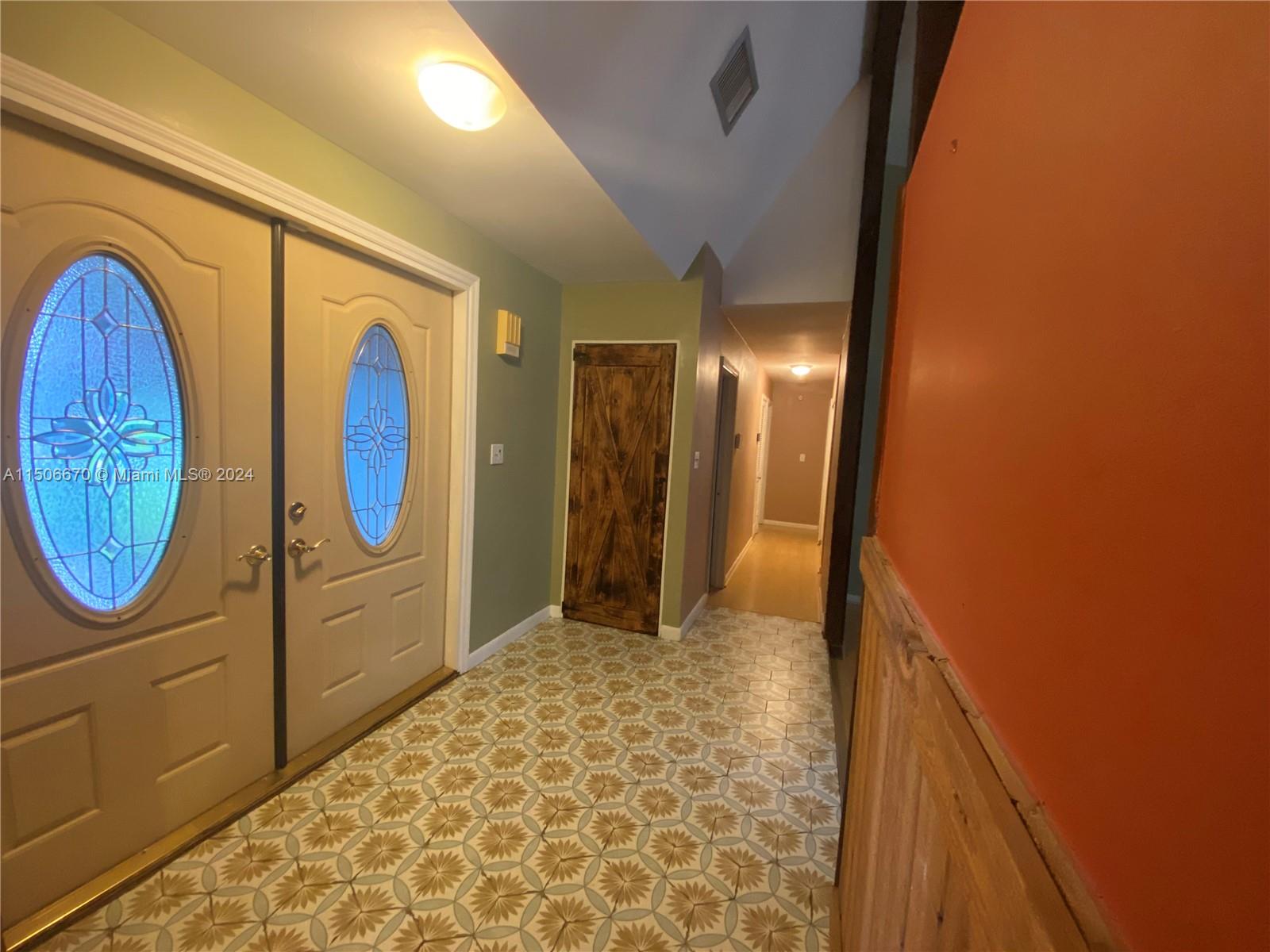 13341 Southwest 101st Street Miami, FL 33186 - Photo 15 of 43 a view of a entryway door with wooden floor