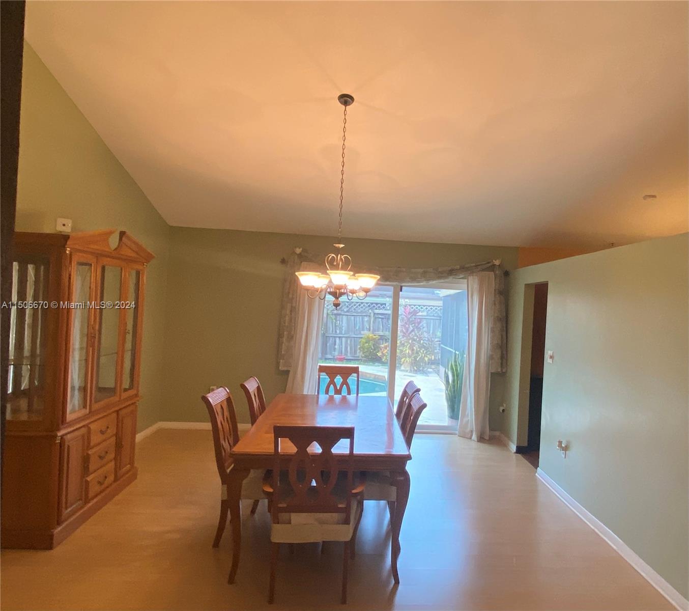 13341 Southwest 101st Street Miami, FL 33186 - Photo 16 of 43 a view of a dining room with furniture window and outside view