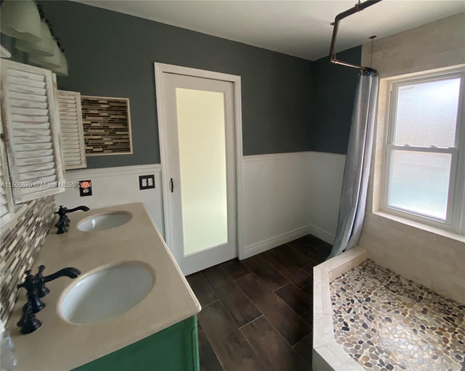 13341 Southwest 101st Street Miami, FL 33186 - Photo 30 of 43 a bathroom with a sink and a mirror