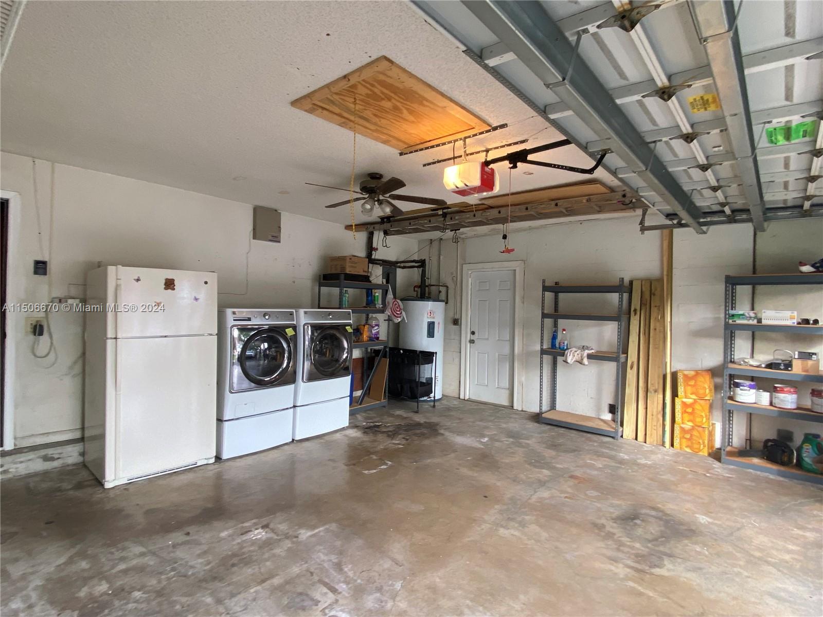 13341 Southwest 101st Street Miami, FL 33186 - Photo 37 of 43 a view of a storage & utility room with washer and dryer