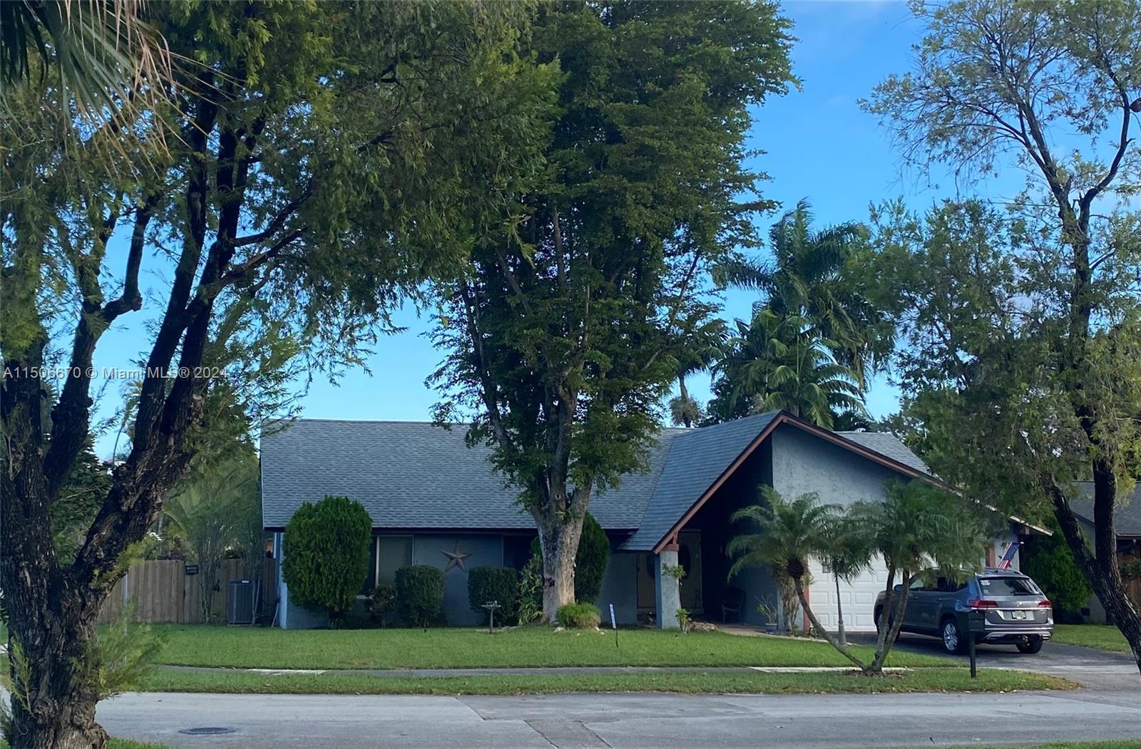 13341 Southwest 101st Street Miami, FL 33186 - Photo 41 of 43 a front view of house with yard and green space