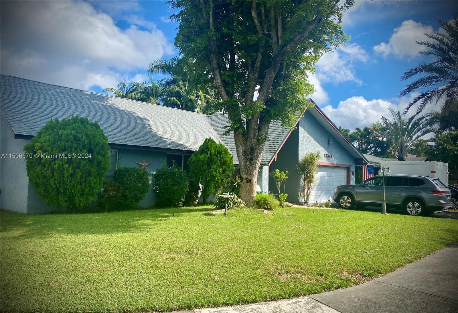 13341 Southwest 101st Street Miami, FL 33186 - Photo 10 of 43 a front view of house with yard and green space