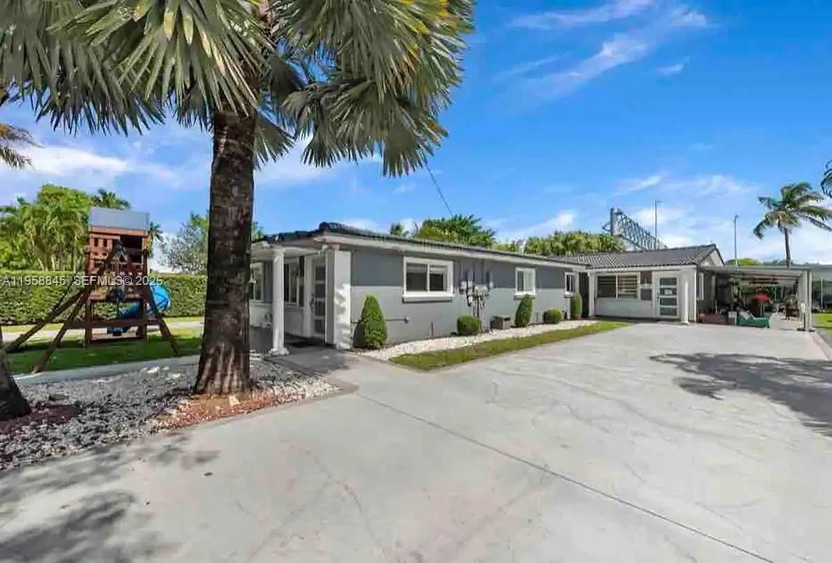 3008 Northwest 13th Street Miami, FL 33125 - Photo 1 of 32 a front view of house with yard and green space
