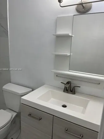 a bathroom with a sink and a toilet