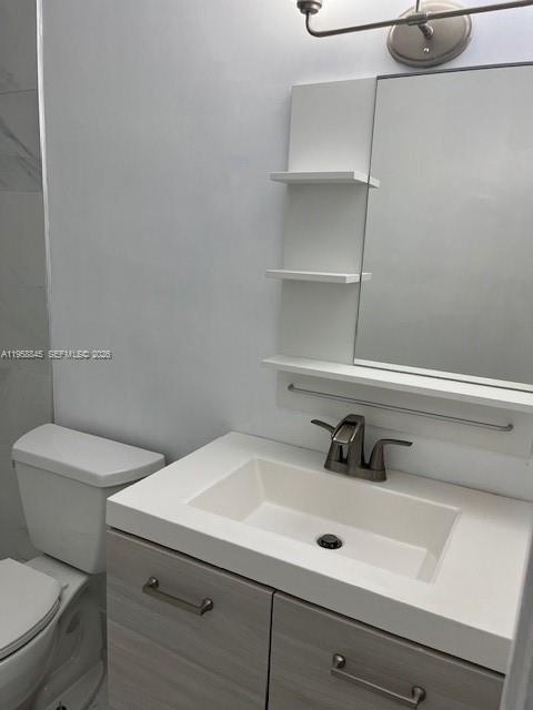3008 Northwest 13th Street Miami, FL 33125 - Photo 12 of 32 a bathroom with a sink and a toilet