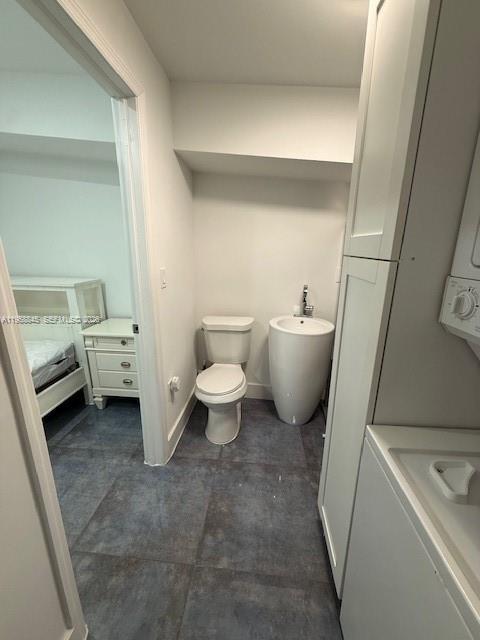 3008 Northwest 13th Street Miami, FL 33125 - Photo 30 of 32 a bathroom with a toilet sink and a mirror