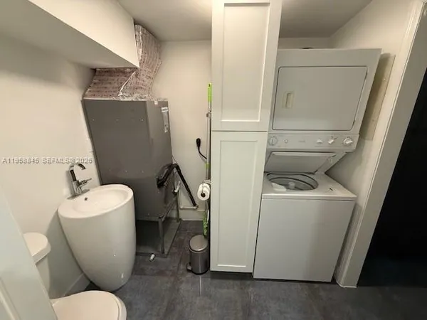 a bedroom with a bed and a cabinets
