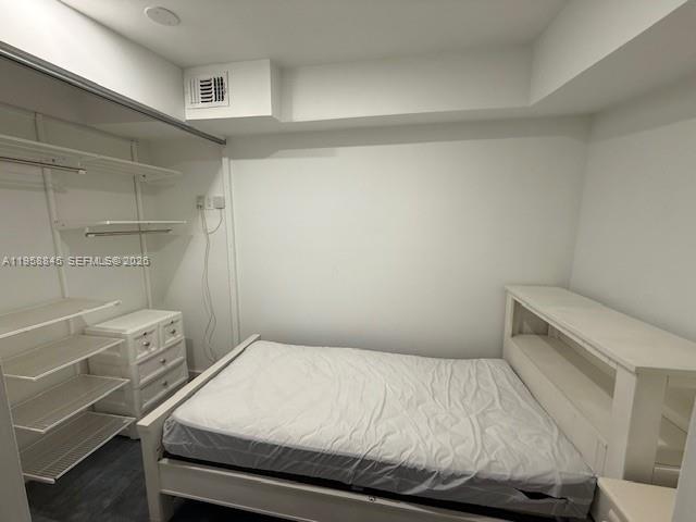 3008 Northwest 13th Street Miami, FL 33125 - Photo 32 of 32 a bedroom with a bed and a cabinets