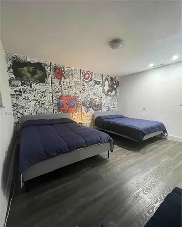 a bedroom with a bed and dresser