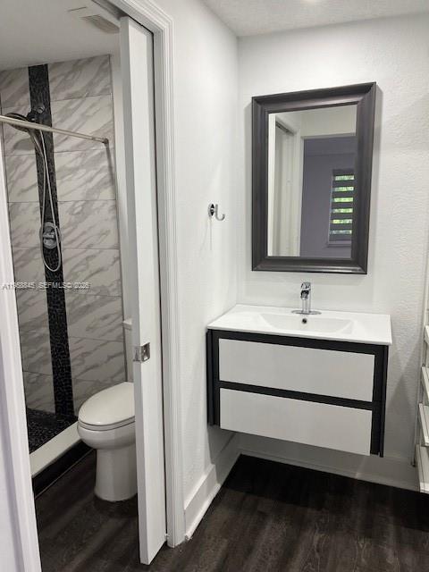 3008 Northwest 13th Street Miami, FL 33125 - Photo 9 of 32 a bathroom with a toilet sink and mirror